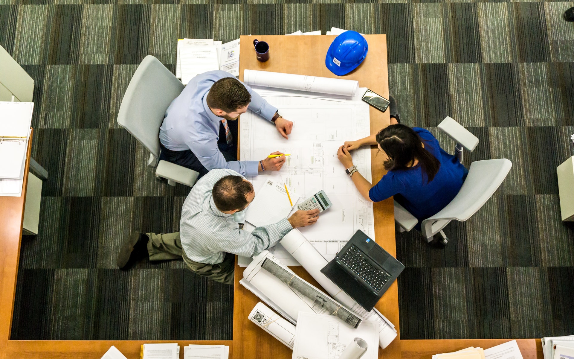 A group of people discussing their construction project.